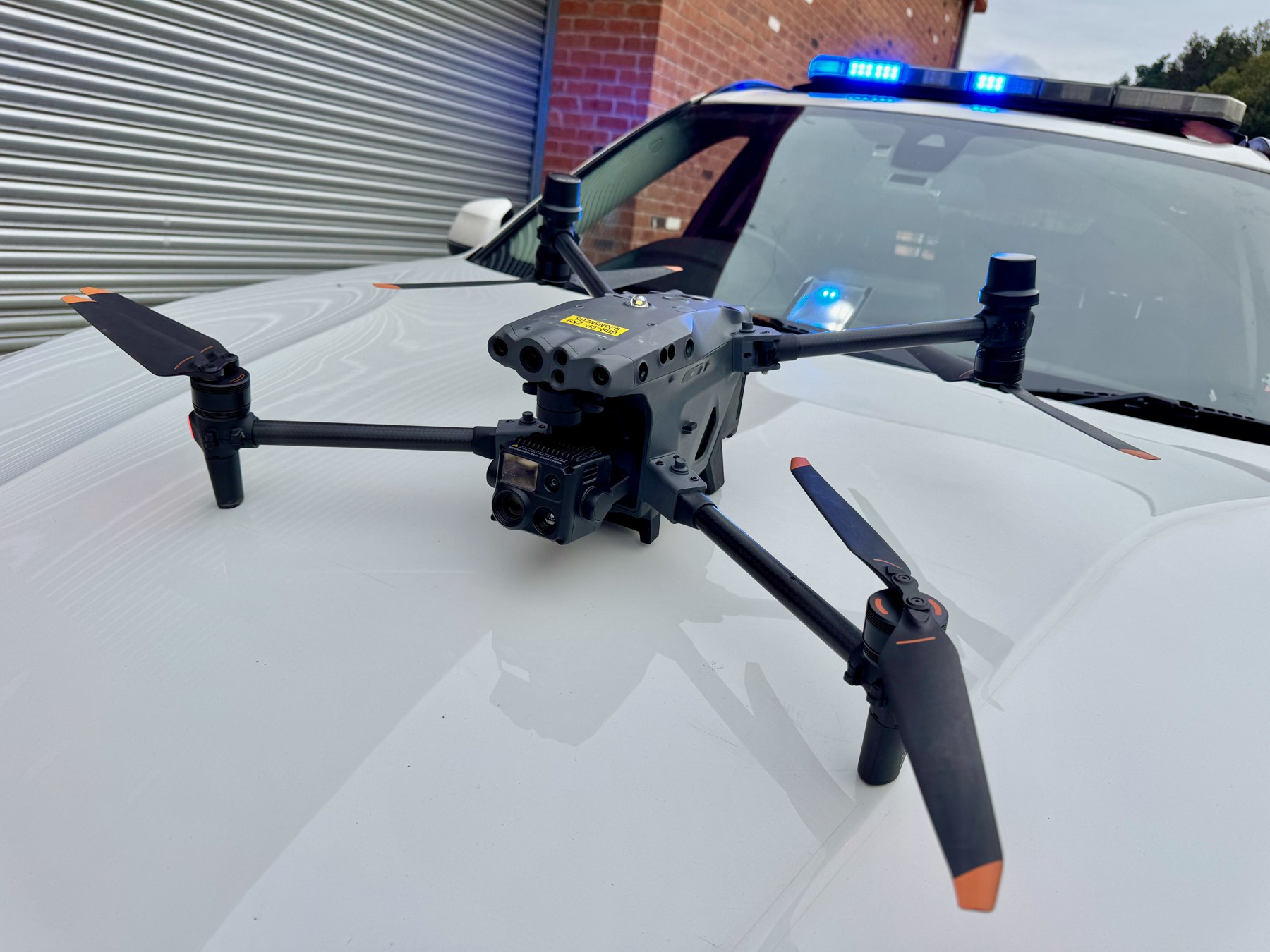 Camera-equipped drone on the bonnet of a UK response vehicle